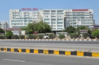 Heritage IMS Hospital Varanasi exterior view from main road showing large multispeciality hospital building and infrastructure