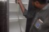 Cubboard pest control by a man