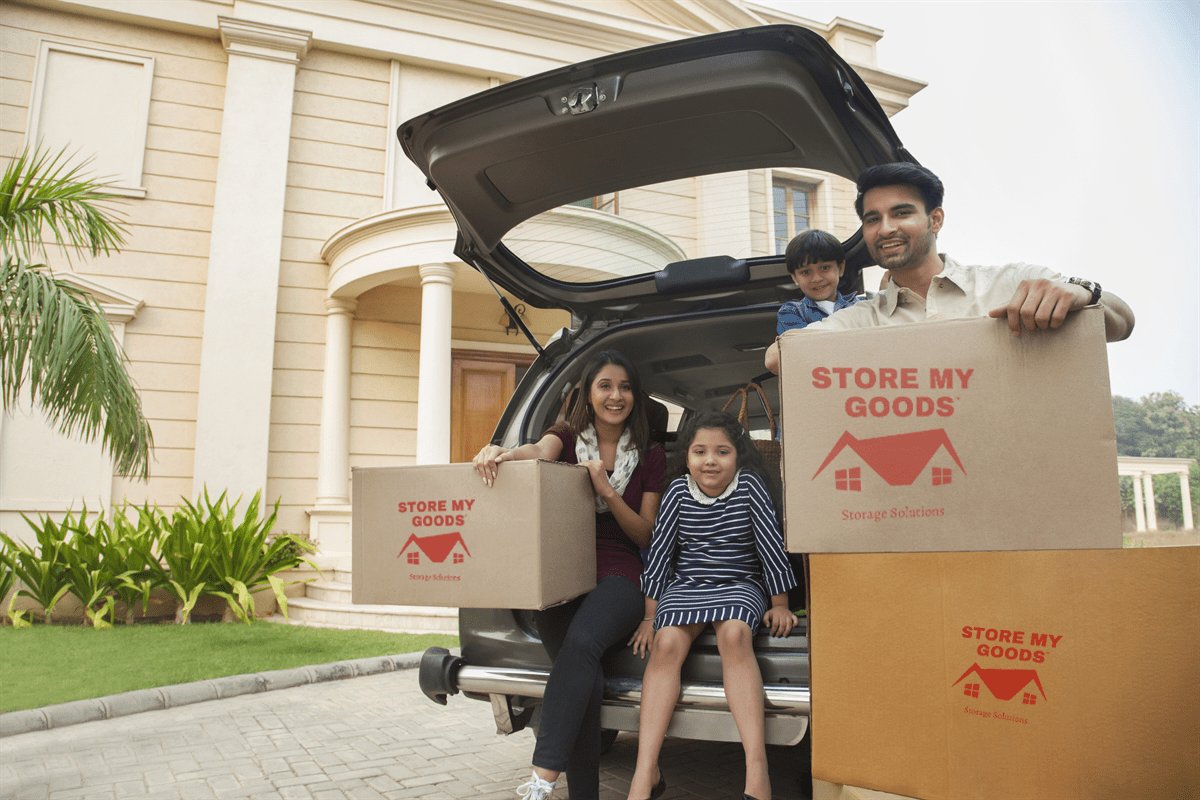 Family loading Store My Goods storage boxes into an SUV for secure storage